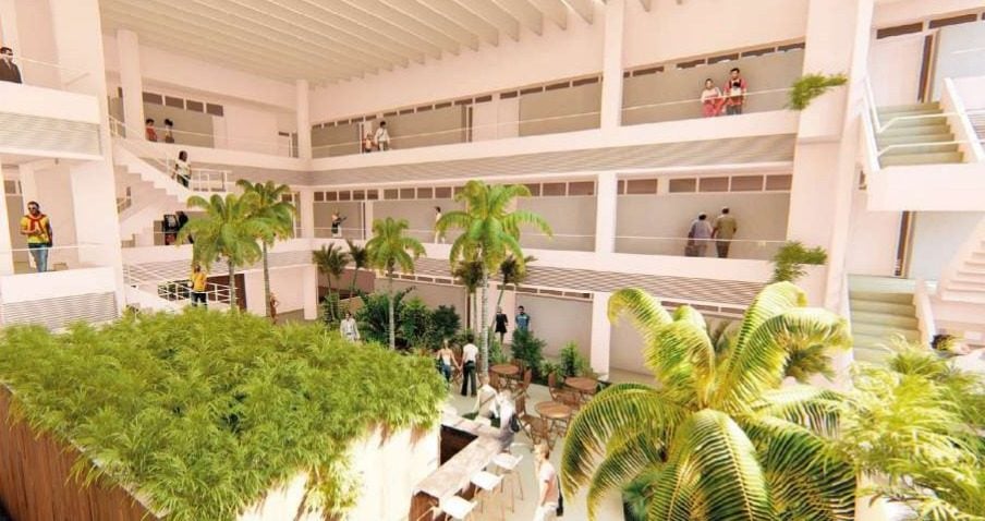 Render del patio central de Margarita Real 2, con jardines, palmeras y pasillos abiertos en tres plantas